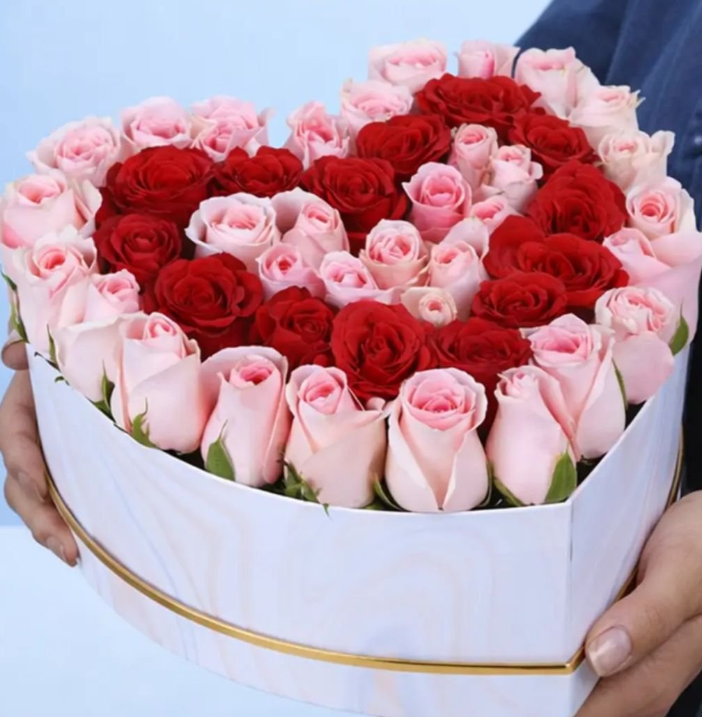 White heart box with red and pink roses